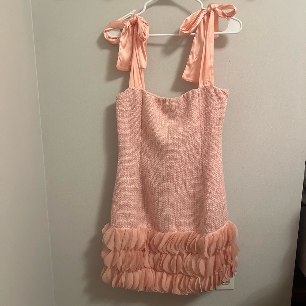 Pink mini ruffle dress with ties on shoulders